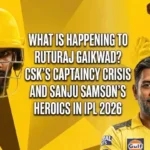 Feature image banner for a sports article about IPL 2026, comparing current CSK captain Ruturaj Gaikwad's form against former captain MS Dhoni. The image shows a composite of Ruturaj Gaikwad in a helmet (left), MS Dhoni smiling (right), with the background profiles of Sanju Samson. Bold white text asks 'What is happening to Ruturaj Gaikwad? CSK’s captaincy crisis and Sanju Samson’s heroics in IPL 2026'. The background has a geometric yellow and black design